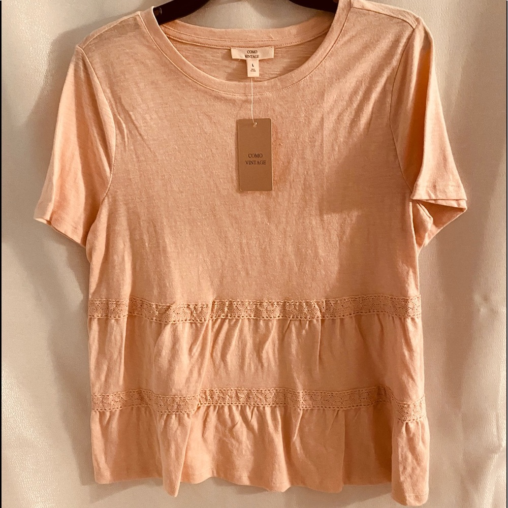 Short sleeve ruffled tee shirt. Peach colored